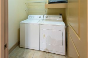 Apartments in Uptown Houston, Galleria Area A laundry room with a washer and dryer conveniently available in apartments in Uptown Houston.