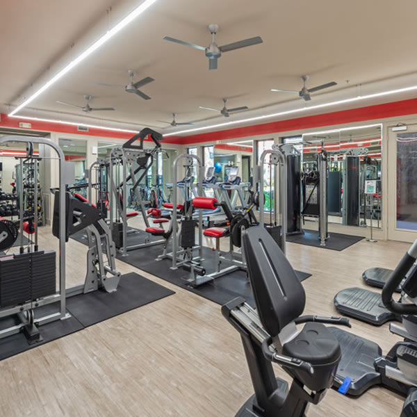 Apartments in Uptown Houston, Galleria Area A gym room with exercise equipment and a fan, conveniently located in apartments in the Galleria Area or Uptown Houston.