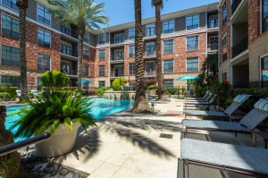 Apartments for Rent in Houston, TX - Up Close Pool Area & Lounge Chairs      